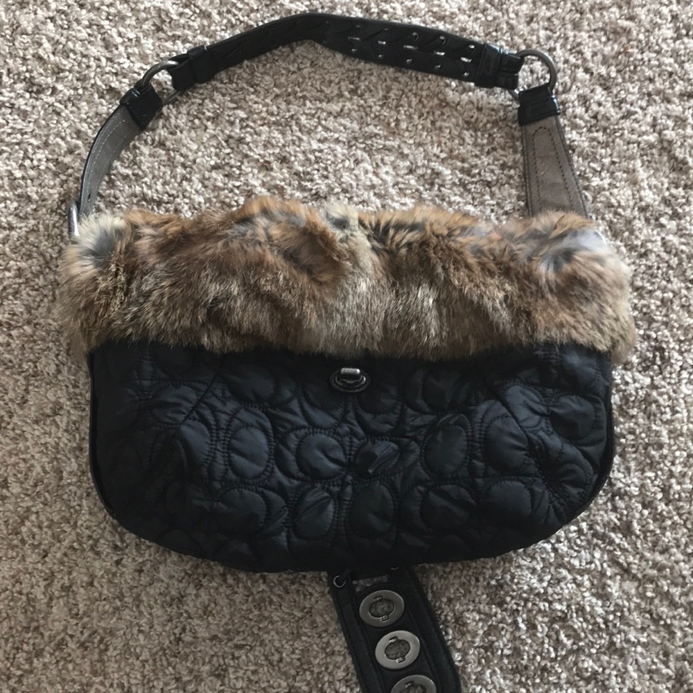 Woman’s Coach fur trimmed handbag